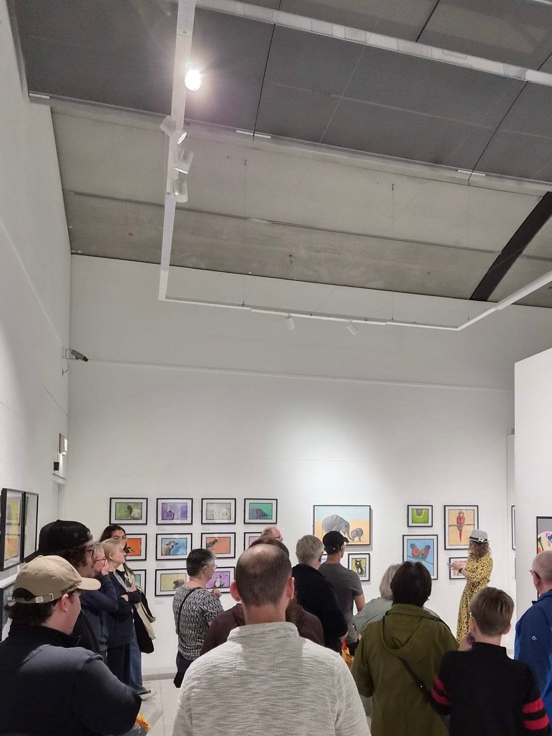 People gathered in Wild Lives exhibition opening event