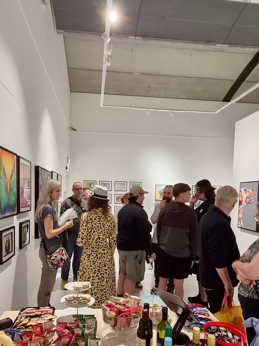 People gathered in Wild Lives exhibition opening event